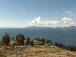 R-L Pan of Lake Titicaca [Lago Chucuito] from hill at Copacabana, Bolivia Stock Footage