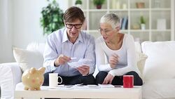senior couple calculating domestic bills Stock Footage