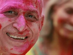 Portrait of a senior man celebrating holi festival Stock Footage