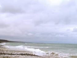 WS PAN from Pacific Ocean across beach to San Onofre nuclear power plant shut down in 2013 / Pendleton, California, USA Stock Footage