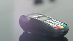 Woman making payment with credit card and entering PIN code Stock Footage