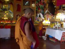MS POV Buddhist monk folding and arranging  his garments and  another monk organizing shrine   / Kathmandu, Central, Nepal Stock Footage