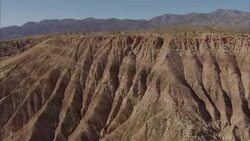 Eroded buttes and rock formations characterize a California desert. Stock Footage