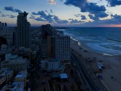 Elevated dusk view of the city beachfront,  Tel Aviv, Israel, Middle East Stock Footage