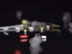 HD SLOW MOTION: Medicaments Falling On Glass Stock Footage