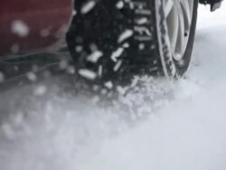 HD Super Slow-Mo: Car Wheel Spinning In The Snow Stock Footage