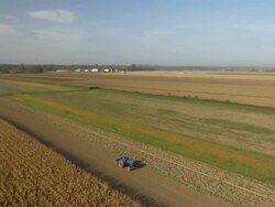 AERIAL Tractor Cultivating The Field Stock Footage