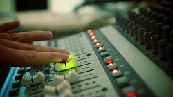Hand adjusting audio mixer Stock Footage