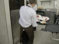POV waiter carrying tray of sweets from a restaurant kitchen to the dining room; camera follows waiter Stock Footage