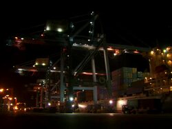 WS Large cranes in nice sequence at dock in night sequence / Djibouti Stock Footage