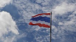 Thailand flag against a blue sky. Part 1 Stock Footage