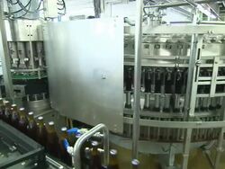 beer production, many bottles, machines, conveyor belt, transporting Stock Footage