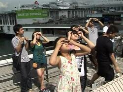 CLEAN: Solar eclipse spreads cloak of darkness over Hong Kong News Clip