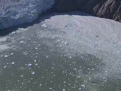 'Multiple aerial push-in push-out-Ice bergs, ice floes, and debris float in a fjord at the foot of a glacier. / Alaska, USA' Stock Footage