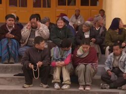 WS People waiting outside Buddhist temple / Dharamsala, Himachal Pradesh, India Stock Footage