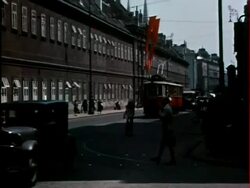 1930s street w/traffic, red swastika flags / Vienna, Austria Stock Footage