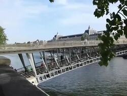 Passerelle Leopold-Sedar-Senghor bridge over River Seine next to Musee d'Orsay, Paris, France Stock Footage