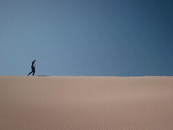 Businesswoman in desert Stock Footage