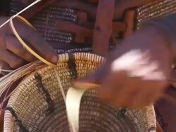 CU Shot of native himba woman weaving basket / Himba, Kunene, Namibia Stock Footage