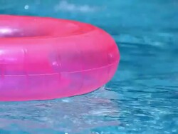 Swimming Pool Float and Ball Stock Footage