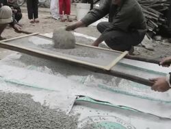 Villagers at work making water filters Stock Footage