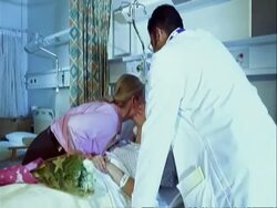 MS track to medic talking to patient, visitor arrives with flowers Stock Footage