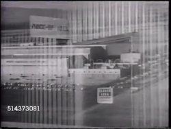 1959: EXPERIMENTAL AIRCRAFT: AERIAL North American Aviation factory. MOCK UP AREA: MS Sign on door 'Closed Area, Confidential, Clearance Required', men walking in airplane warehouse working hangar, ZO WS Partial XB-70 'Valkyrie' being built. Instructional Video