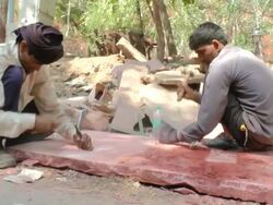 MS Shot of Men hammering with chisel / Delhi, India Stock Footage