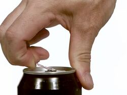  CU SLO MO Hand of man opening can of beer and beer splashing / Vieux, Normandy, France   Stock Footage