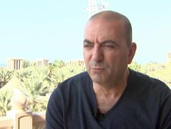 INTERVIEW - Hany Abu-Assad - 'Omar' Press Junket at Koubba Bar - 10th Annual Dubai International Film Festival Stock Footage