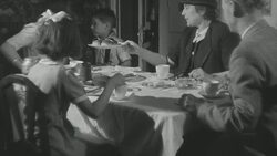 1947 MS Family sitting at table eating dinner together / United Kingdom Stock Footage