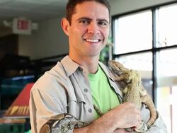 MS TU Pet shop owner holding some reptiles / Santa Fe, New Mexico, United States Stock Footage