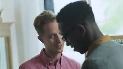 Excited customer hands over credit card for cashier to swipe on tablet card reader Stock Footage