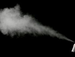 Spraying on black background Stock Footage