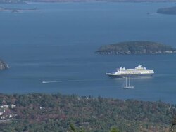 PAN Cruise ship and boats floating in a bay among small islands and the coastline / Mount Desert Island, Maine, United States Stock Footage