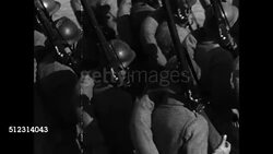 1934: GERMAN TROOPS: HD: MS German Nazi bugler, VS German soldiers, marching in formation, w/ rifles shouldered, riding on ammunition ammo carts, VS Cavalry horse soldiers riding w/ swords drawn, escorting artillery. WS Infantry marching. Note: Film Instructional Video