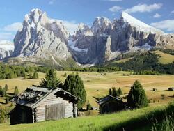 HA Small cabin in an alpine meadow in front of snow-capped peaks / Italy Stock Footage