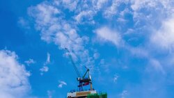 Building construction site against blue sky Stock Footage