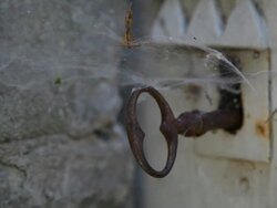Keyhole and spider web, close up Stock Footage
