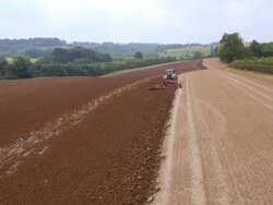 Aerial view of Tractor Ploughing Stock Footage