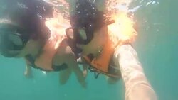 Couple snorkeling surface level in sea Stock Footage