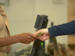 CU, Client passing money to sales clerk at checkout counter, mid section, Soho, New York City, New York, USA Stock Footage