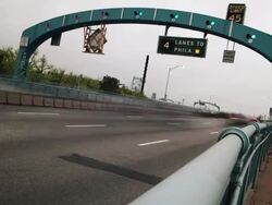 Time lapse, cars and traffic drive on interstate highway across Ben Franklin Bridge. Stock Footage