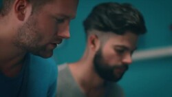 Guys playing tabletop soccer in apartment Stock Footage