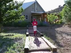 MS Shot of young baseball player walking up to his home / Santa Fe, New Mexico, United States Stock Footage