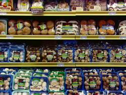 MS Shot of packaged vegetables and mushrooms on supermarket shelves / Mall of America Minneapolis, Minnesota, United States Stock Footage