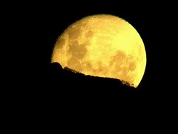 CU AERIAL Shot of Super Moon shining brightly in night sky / Cape Town, Western Cape, South Africa Stock Footage