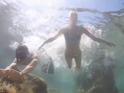 HD SLOW MOTION: Couple Having Fun In The Sea Stock Footage