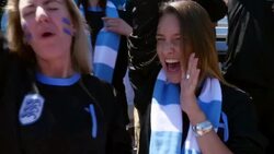 MS PAN Group of friends wearing team jersey cheering in crowd during soccer match in stadium Stock Footage