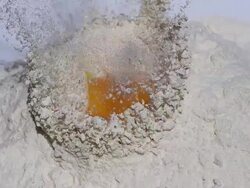 High speed Egg falling into flour Stock Footage